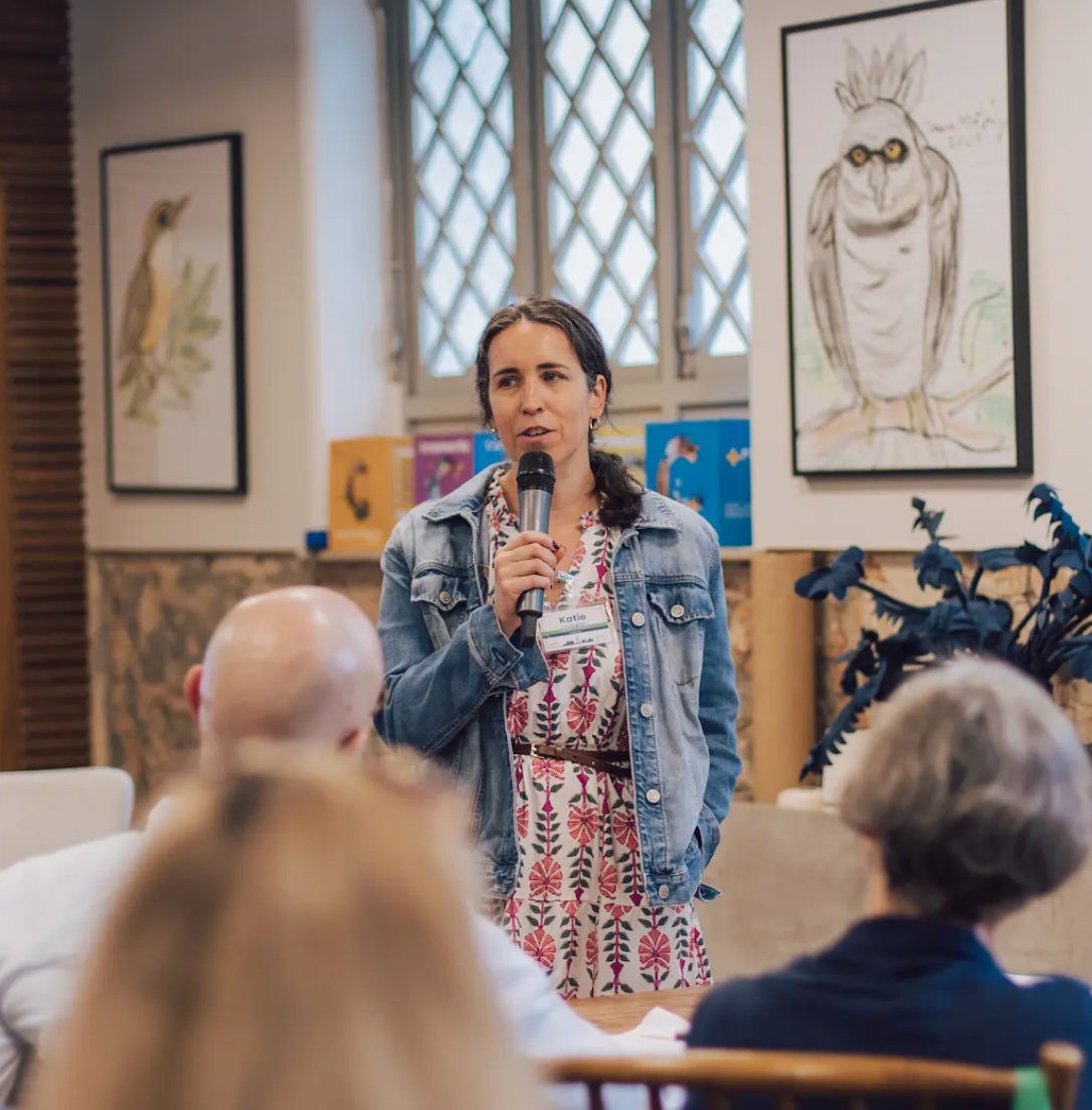 Katie speaking with a group of educators